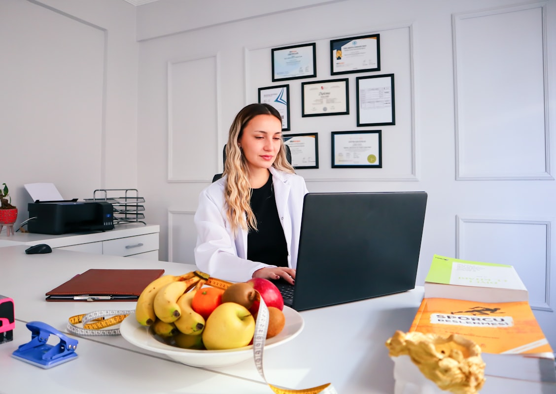 Nutritionist preparing healthy meal with fresh vegetables